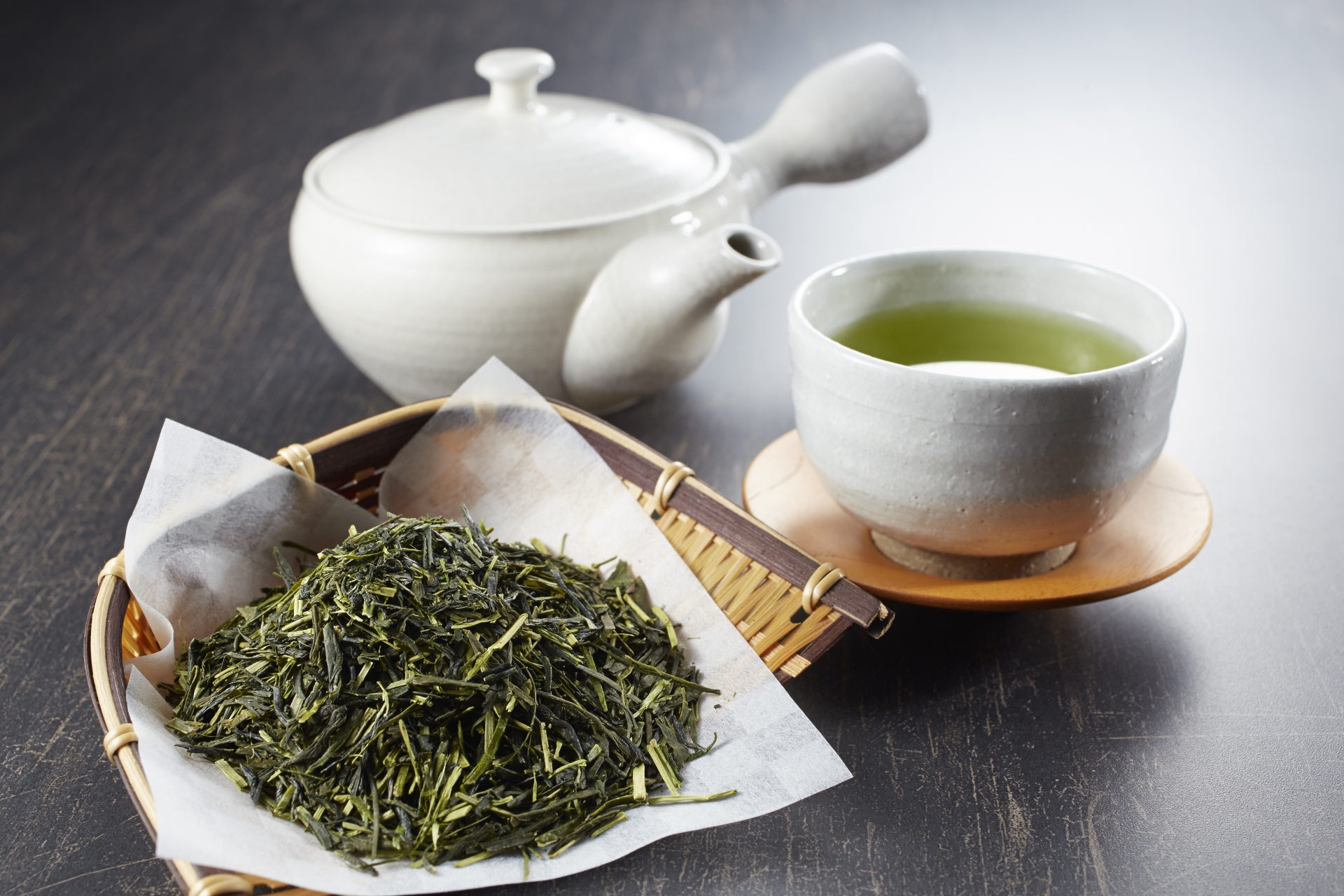 Japanese tea with a kyusu, teacup and loose tea leaves.