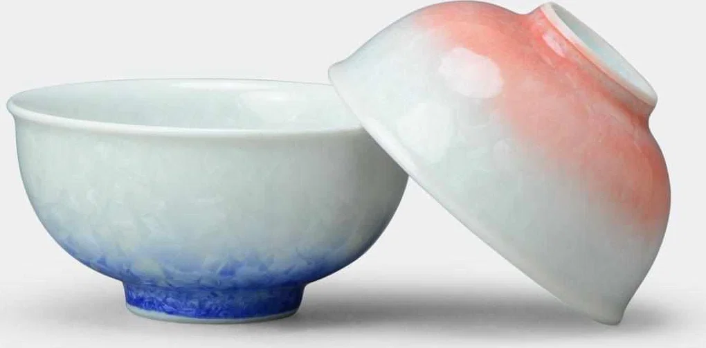 Blue and red Flower Crystal porcelain rice bowls shown together.