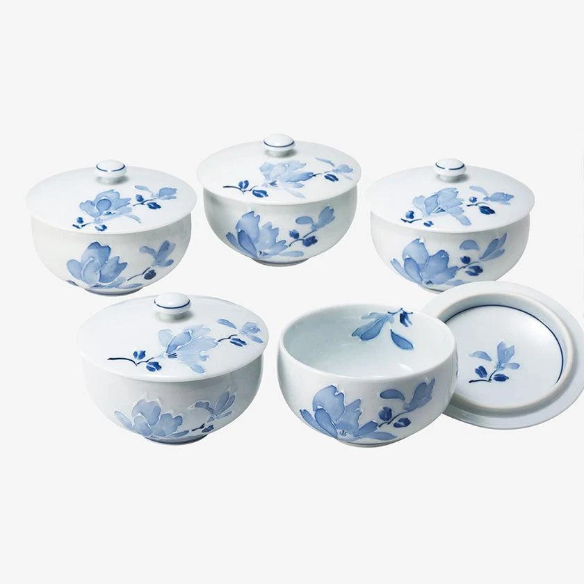 Five Saikai Toki Tsujigahana porcelain yunomi with lids and pale blue floral decoration.