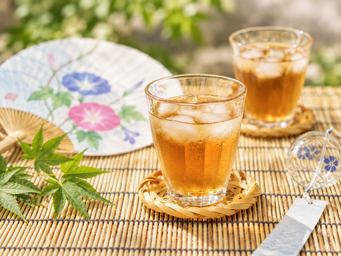 Glasses of chilled mugicha with ice on a Japanese summer table.